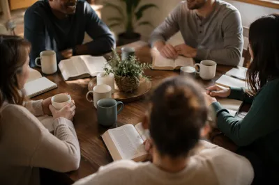 Multiethnic Bible Study Discussion Around Wooden Table