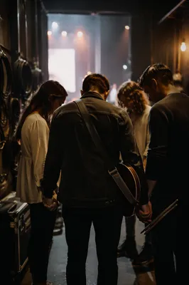 Backstage Musicians in Prayer Circle