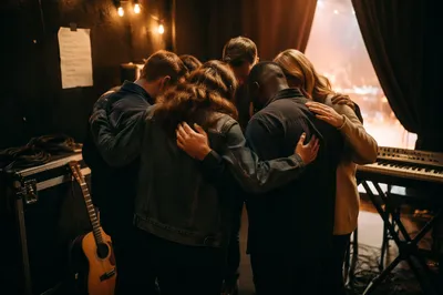 Backstage Musicians in Quiet Prayer Circle