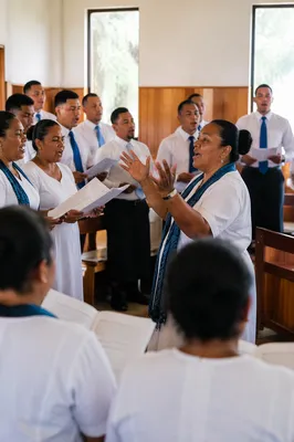 Pacific Islander Choir Singing in Sunlit Chapel