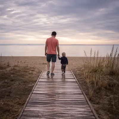 Parent and Child Walking to Quiet Beach