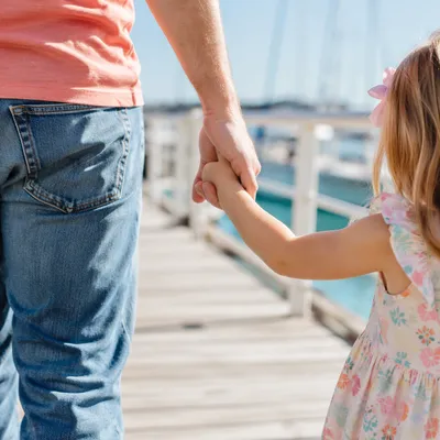Parent and Child Walking Hand in Hand