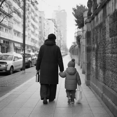 Parent and Child Walking Hand in Hand