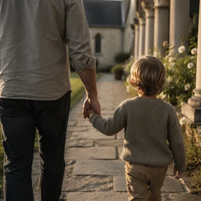 Parent and Child Walking by Chapel Garden