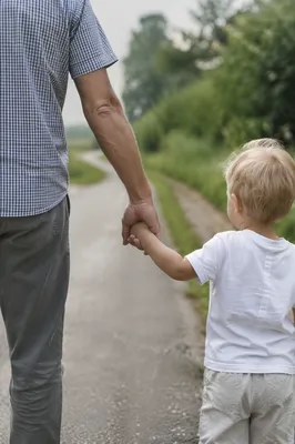 Parent and Child Walking Hand in Hand