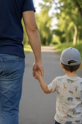 Parent and Child Walking Hand in Hand