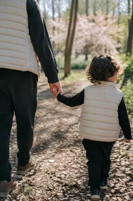 Parent and Child Walking Hand in Hand