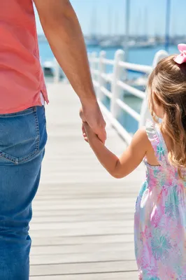 Parent and Child Walking Hand in Hand