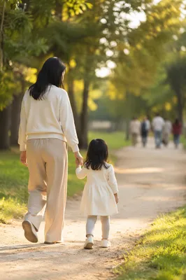 Parent and Child Walking Hand in Hand