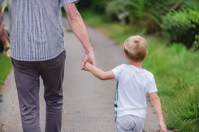 Parent and Child Walking Hand in Hand