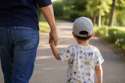 Parent and Child Walking Hand in Hand