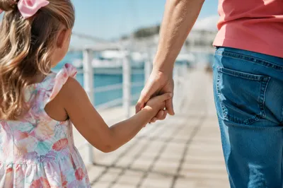 Parent and Child Walking Hand in Hand