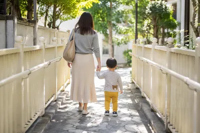Parent and Child Walking Hand in Hand