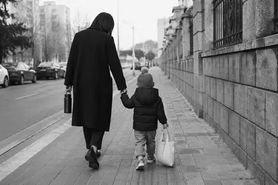 Parent and Child Walking Hand in Hand