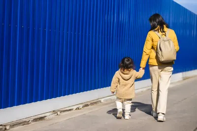 Parent and Child Walking Hand in Hand