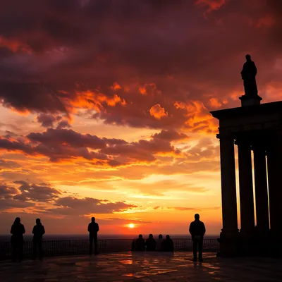 Contemplative Silhouettes Beneath Dramatic Sunset Clouds