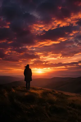 Lone Silhouette on Dramatic Sunset Ridge