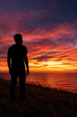 Solitary Man Silhouette on Coastal Bluff