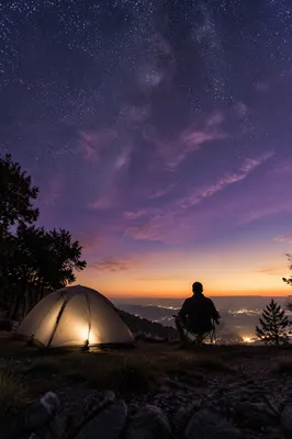Solitary Camper Silhouette Under Twilight Stars
