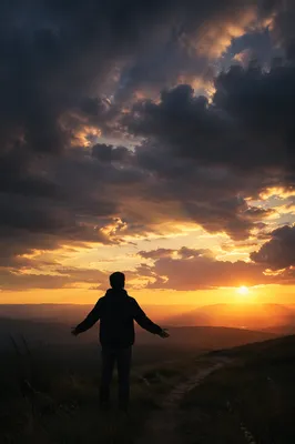 Silhouetted Prayer at Dramatic Sunset Ridge