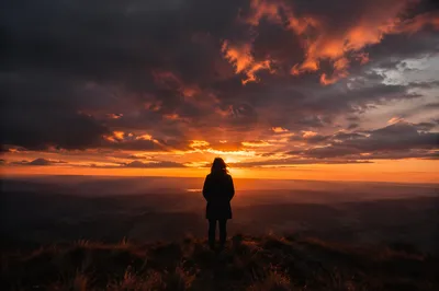 Lone Silhouette on Dramatic Sunset Ridge