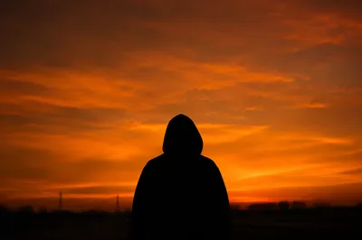 Dramatic Person Silhouette at Sunset Sky