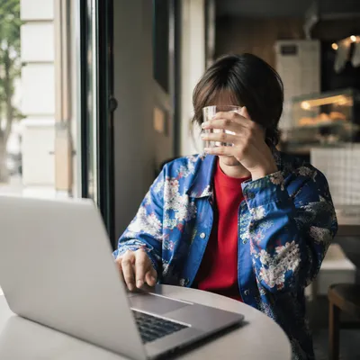 Focused Laptop Work in Cozy Cafe