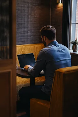 Focused Laptop Work in Quiet Cafe