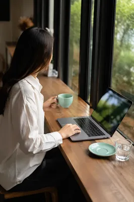 Focused Laptop Work in Quiet Cafe