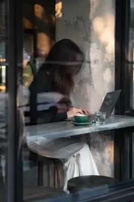 Focused Laptop Work at Cozy Cafe