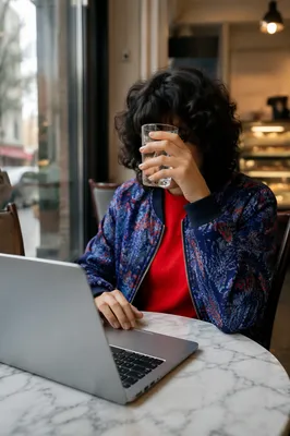 Focused Laptop Work in Cozy Cafe