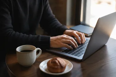 Focused Laptop Work at Quiet Cafe