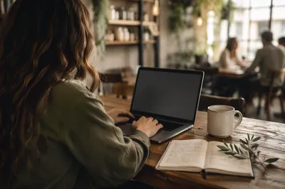 Focused Laptop Work in Cozy Cafe
