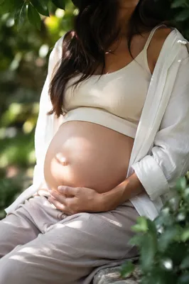 Serene Pregnancy Portrait in Garden Light
