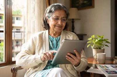 Senior Woman Learning Tablet by Window