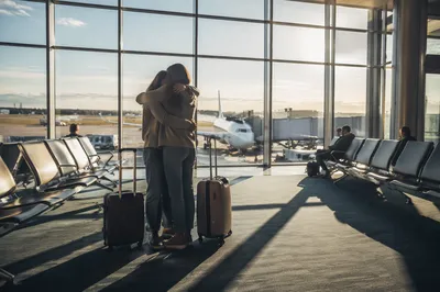 Sibling Reunion Hug at Airport Arrival