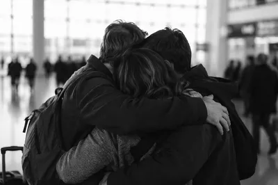 Sibling Reunion Hug at Airport Arrival