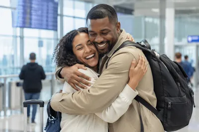 Siblings Embracing at Airport Arrival Gate
