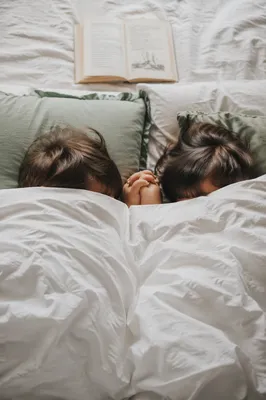 Siblings Praying Together at Bedtime
