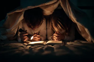 Siblings Praying in Bedtime Blanket Fort