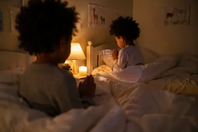 Siblings Sharing Bedtime Prayer in Warm Light