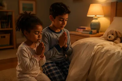 Siblings Praying Beside Bed at Night