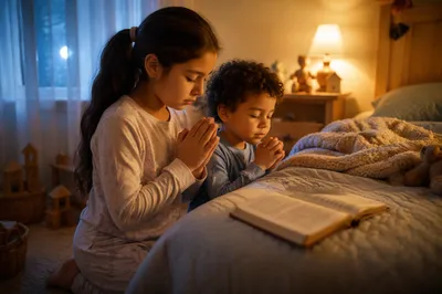 Siblings Praying Beside Bed at Night