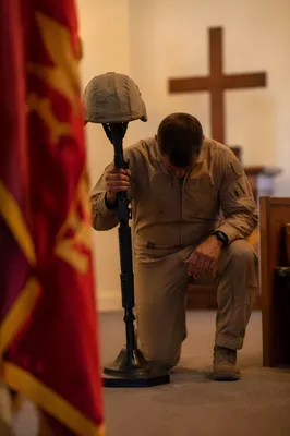 Soldier Kneeling in Prayer by Chapel Cross