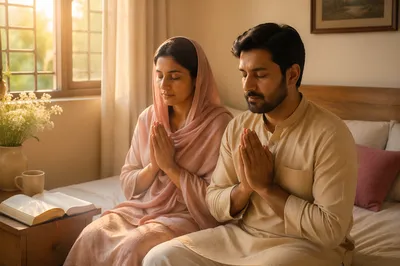 South Asian Couple Praying by Window