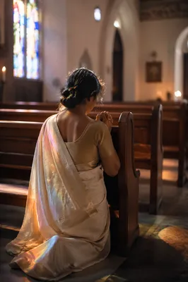 South Asian Woman Praying in Church Sari