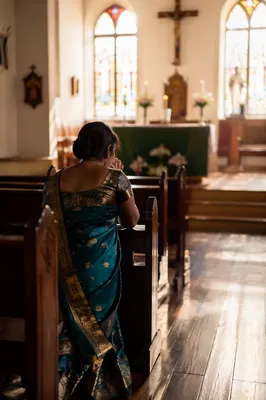 South Asian Woman Praying in Church