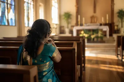 South Asian Woman Praying in Teal Sari