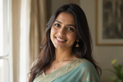 Smiling South Asian Woman in Teal Sari