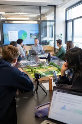 Teacher Guiding Diverse Students in Modern Classroom
